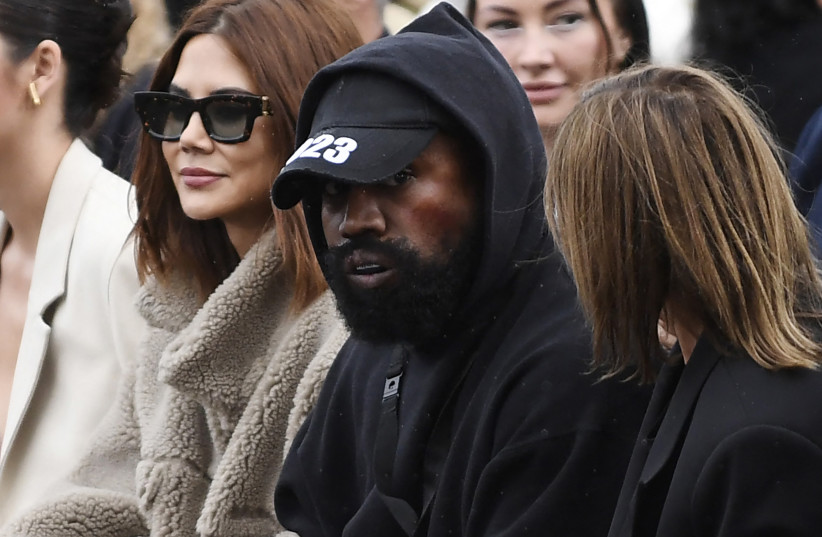  US rapper Kanye West (C), attends the Givenchy Spring-Summer 2023 fashion show during the Paris Womenswear Fashion Week, in Paris, on October 2, 2022.  (credit: JULIEN DE ROSA/AFP via Getty Images)