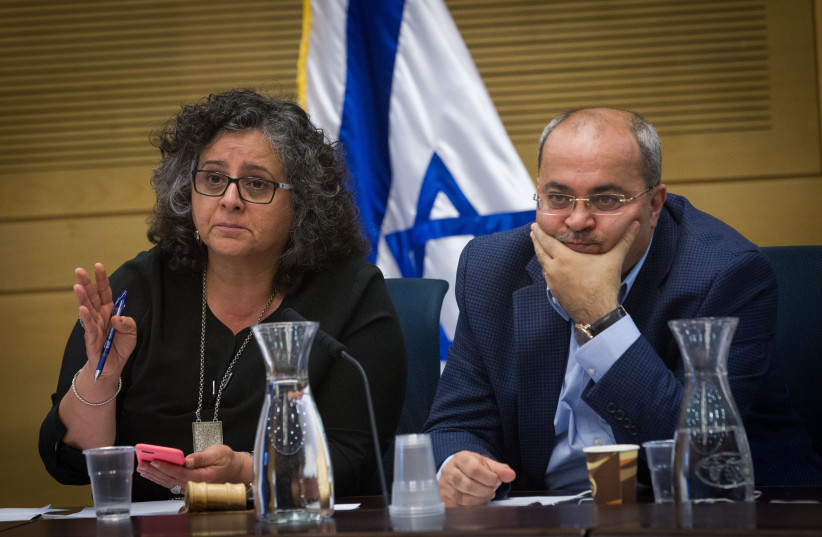 Arab MKs (L-R) Aida Touma-Suleiman and Ahmad Tibi attend a Committee on the Status of Women and Gender Equality during a discussion on the segregation between women in maternity wards, in the Israeli parliament on April 13, 2016. (photo credit: MIRIAM ALSTER/FLASH90)
