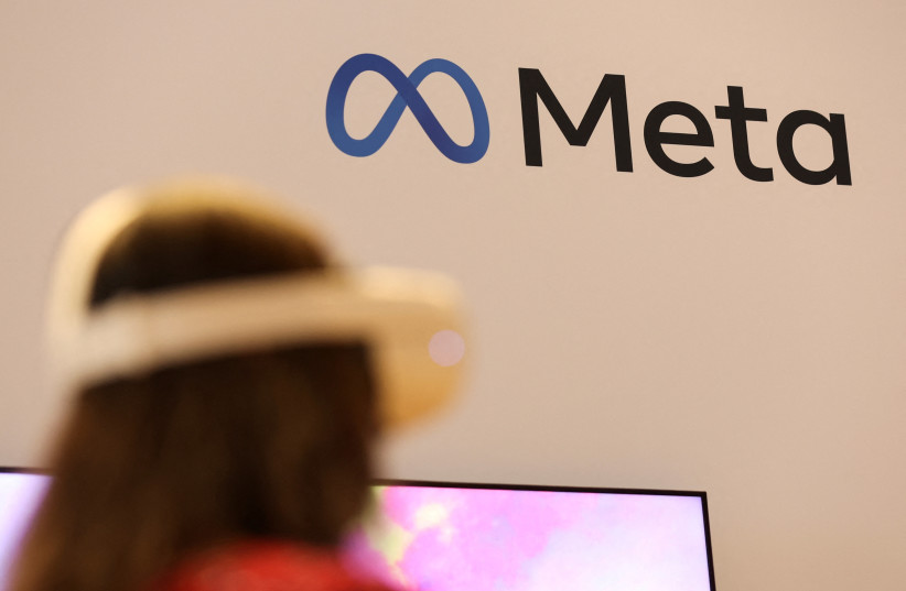  A person uses virtual reality headset at Meta stand during the ninth Summit of the Americas in Los Angeles, California, US, June 8, 2022. (credit: REUTERS/MIKE BLAKE)