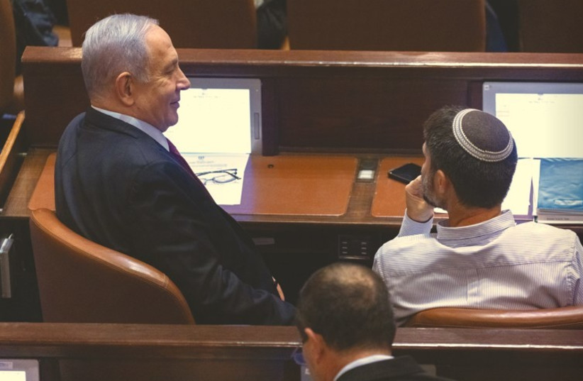  BENJAMIN NETANYAHU and Bezalel Smotrich sit alongside each other in the Knesset plenum. Had the opposition – meaning Bibi and Smotrich – behaved in a responsible way, they would have supported legislation that was consistent with their beliefs, says the writer. (photo credit: OLIVIER FITOUSSI/FLASH90)