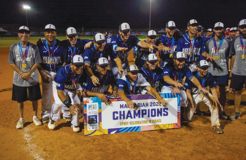  Israel’s softball team with coach Corey Vyner (left), after striking gold at the Maccabiah. (photo credit: ISA)