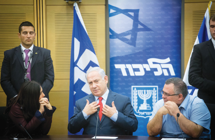  THE CONDUCT of Netanyahu and his obedient cronies over the last year has been nothing less than despicable. (Pictured: With Likud MKs Miri Regev and David Bitan) (photo credit: MIRIAM ALSTER/FLASH90)