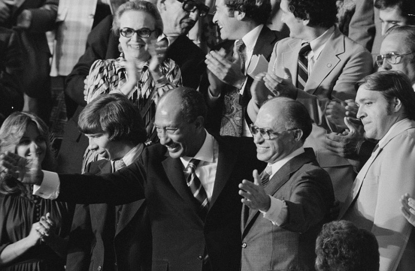  EGYPTIAN PRESIDENT Anwar Sadat and prime minister Menachem Begin acknowledge applause during a Joint Session of Congress in which US president Jimmy Carter announced the Camp David Accords results, in Washington, Sept. 1978. (photo credit: LIBRARY OF CONGRESS/WARREN K. LEFFLER/HANDOUT VIA REUTERS)