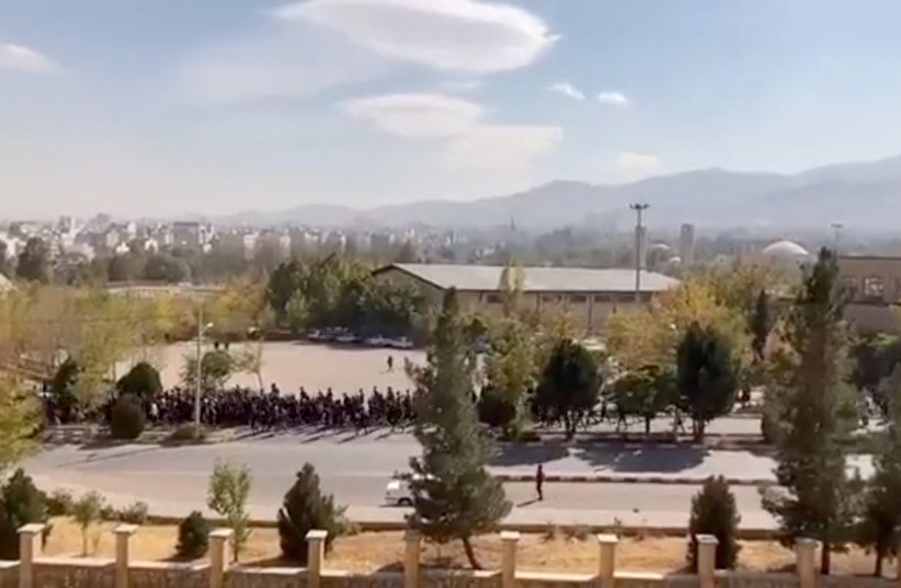  Students chant during a march following the police custody death of Mahsa Amini, which has sparked nationwide anti-government demonstrations, at Bu-Ali Sina University in Hamedan, Iran in this screengrab from social media video released October 26, 2022. (credit: REUTERS)