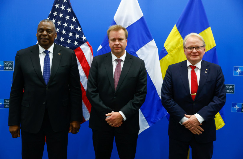 US Secretary of Defense Lloyd J. Austin III, Sweden's Defence Minister Peter Hultqvist and Finland's Minister of Defense Antti Kaikkonen pose for a picture ahead of a trilateral meeting at the end of the second day of a NATO Council Defense Ministers at the Alliance headquarters in Brussels. (credit: STEPHANIE LECOCQ/POOL VIA REUTERS)