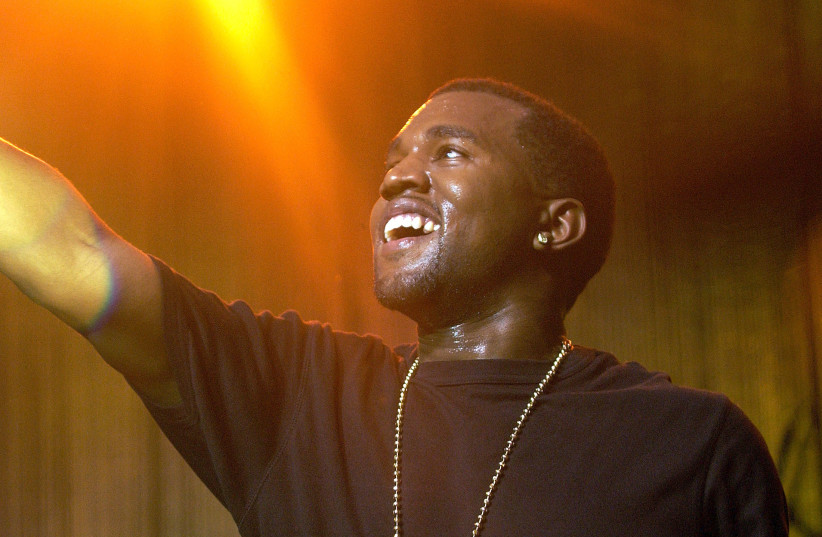 Grammy award-nominated hip-hop artist Kanye West performs at the American Express Jam Sessions at the House of Blues in West Hollywood, California February 9, 2005. West leads the list for this Sunday's 47th Grammy Awards with 10 nominations. (credit: REUTERS/JIM RUYMEN/FILE PHOTO)
