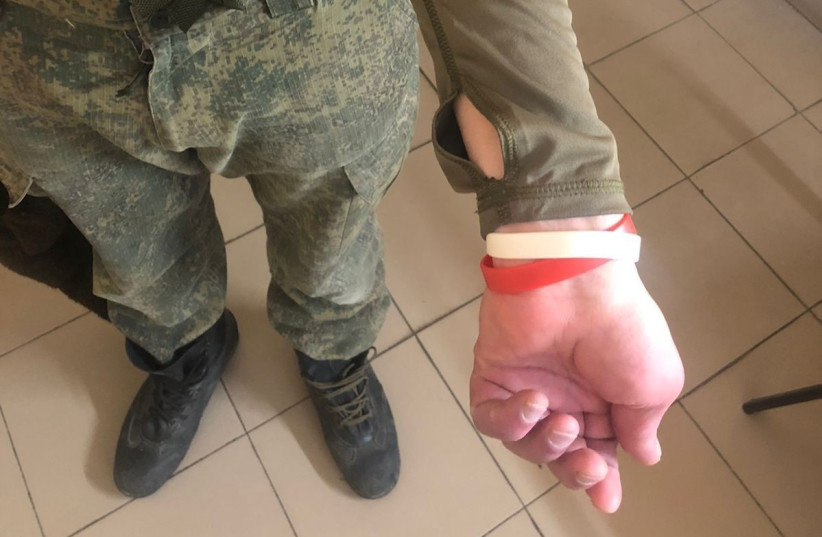 The sick Russian soldiers are identified through the use of color-coded wristbands, red for HIV and white for hepatitis. (credit: THE MINISTRY OF DEFENCE OF UKRAINE)