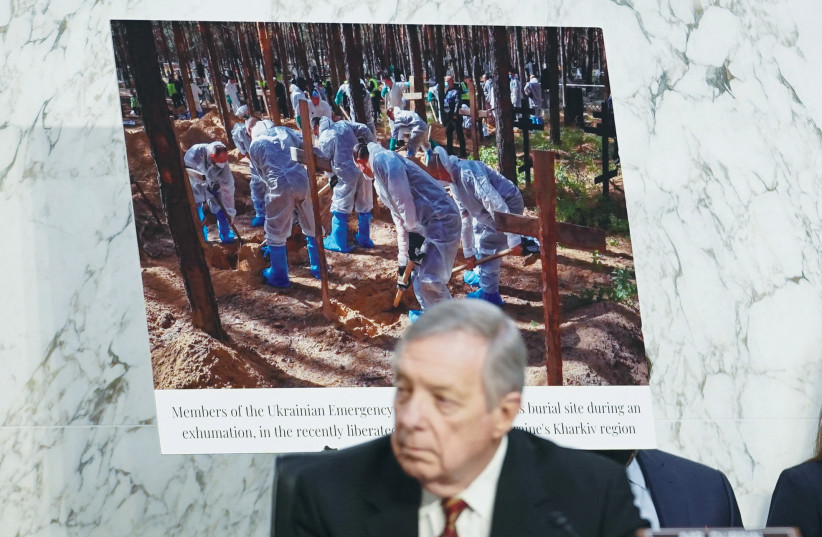  US SENATE Judiciary Committee Chairman Dick Durbin (D-IL) sits alongside a photo from the war in Ukraine during a committee hearing, last month. According to ‘The New York Times,’ Durbin has said Saudi Arabia wants Russia to win the war. (photo credit: REUTERS)