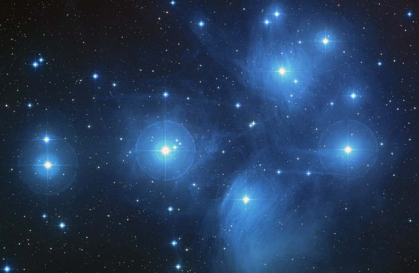 The Pleiades, an open cluster consisting of approximately 3,000 stars at a distance of 400 light-years (120 parsecs) from Earth. (photo credit: NASA, ESA, AURA/Caltech, Palomar Observatory)