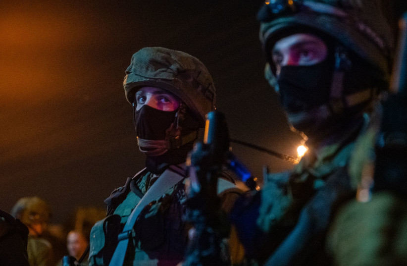  IDF troops operate at the scene of a terror attack in Kiryat Arba, October 29, 2022. (photo credit: IDF SPOKESPERSON'S UNIT)