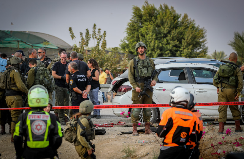  Israeli security forces guard at the scene of a vehicle-ramming attack in the Almog Junction, in the West Bank, October 30, 2022. (photo credit: JAMAL AWAD/FLASH90)