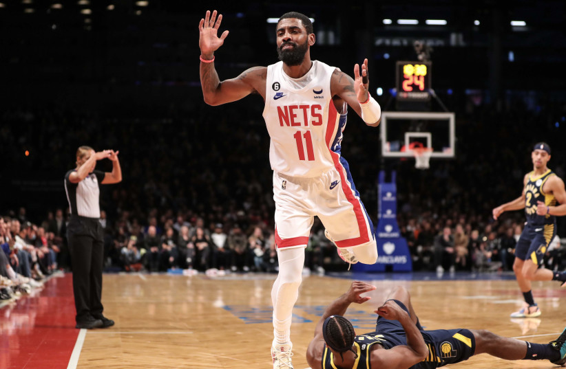  Oct 29, 2022; Brooklyn, New York, USA; Brooklyn Nets guard Kyrie Irving (11) steps over Indiana Pacers guard Buddy Hield (24) after fighting for a loose ball in the second quarter at Barclays Center. (credit: WENDELL CRUZ-USA TODAY SPORTS)