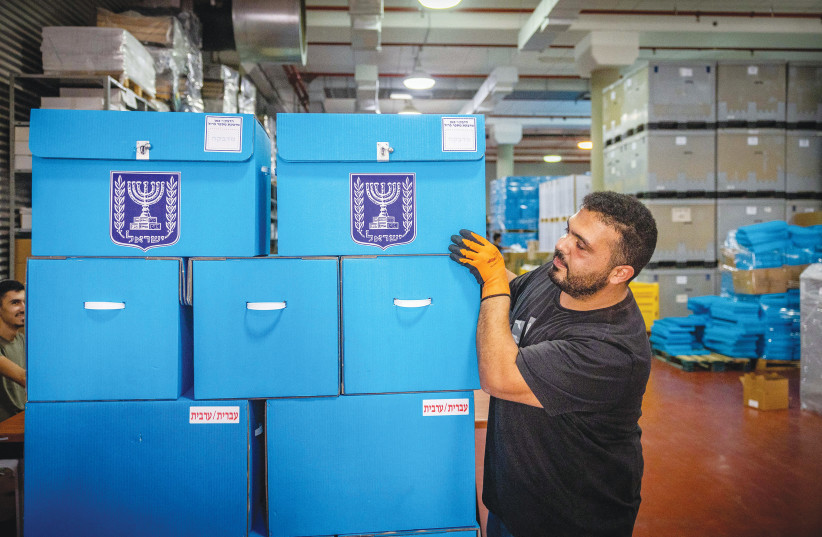  WORKERS PREPARE ballot boxes for the upcoming election at the Central Elections Committee warehouse in Shoham before shipment to polling stations, earlier this month. (photo credit: YONATAN SINDEL/FLASH90)
