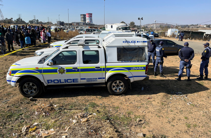  Police cordon off the scene where 15 people were killed by unknown gunmen inside a tavern, in Nomzamo, Soweto, Johannesburg, South Africa, July 10, 2022. (photo credit: REUTERS/Siyabonga Sishi)