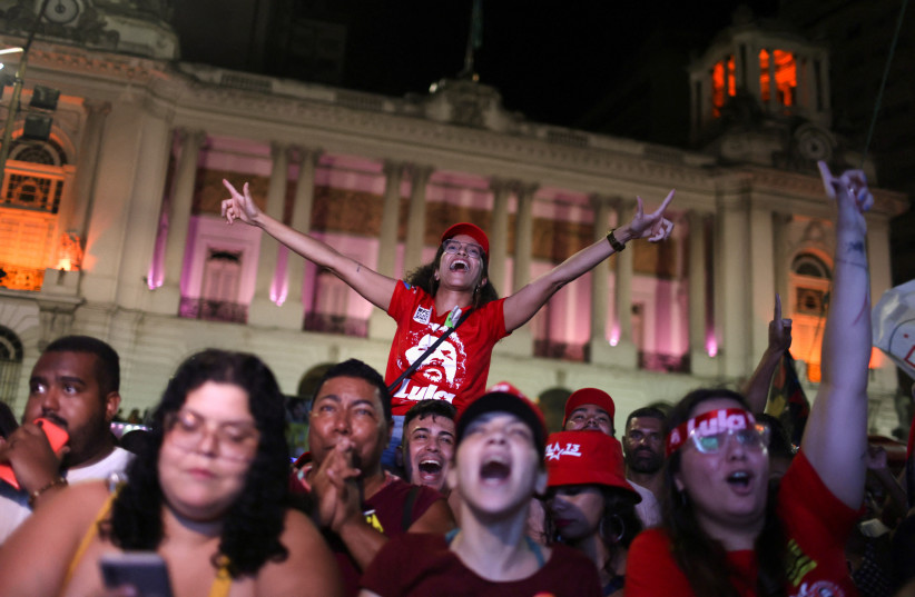  Supporters of Brazil's former President and presidential candidate Luiz Inacio Lula da Silva, react as they wait for the results of the Brazilian presidential election run-off, in Rio de Janeiro, Brazil, October 30, 2022.  (photo credit: REUTERS/PILAR OLIVARES)