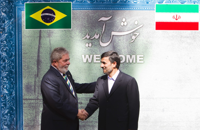  Iran's President Mahmoud Ahmadinejad (R) welcomes his Brazilian counterpart Luiz Inacio Lula da Silva during an official meeting in Tehran May 16, 2010.  (credit: REUTERS/RAHEB HOMAVANDI)
