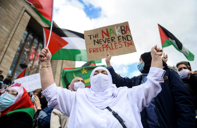  Pro-Palestine supporter gestures during a protest in Brussels, Belgium May 15, 2021.  (photo credit:  REUTERS/JOHANNA GERON)