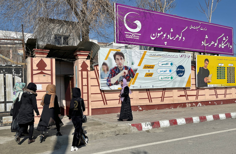  Waheeda Bayat, a 24-year-old student, stands outside Gawharshad University in Kabul, Afghanistan, February 24, 2022. (credit: STRINGER/ REUTERS)