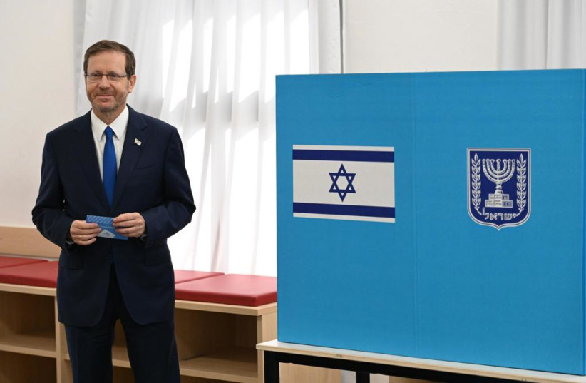  Israeli President Isaac Herzog at the ballot box on Israel's November 2022 elections. (credit: CHAIM TZACH/GPO)