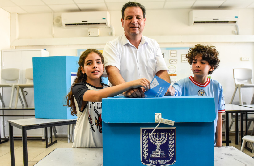  Hadash leader Ayman Odeh casts his ballot at a voting station in Hafia, during the Knesset Elections, on November 1, 2022. (credit: RONI OFER/FLASH90)
