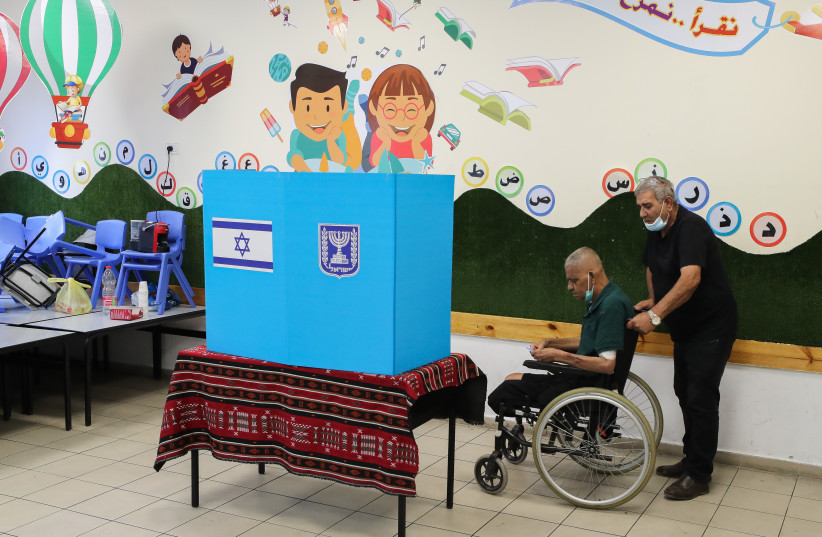  Arab Israelis cast their vote at a voting station in Tayibe, during the Knesset Elections, on November 1, 2022. (photo credit: JAMAL AWAD/FLASH90)