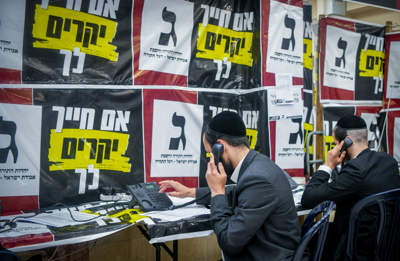  Ultra orthodox Jews seen at the Torah Judaism party headquarters in Bnei Brak, during the Knesset Elections, on November 1, 2022.  (photo credit: ARIE LEIB ABRAMS/FLASH 90)