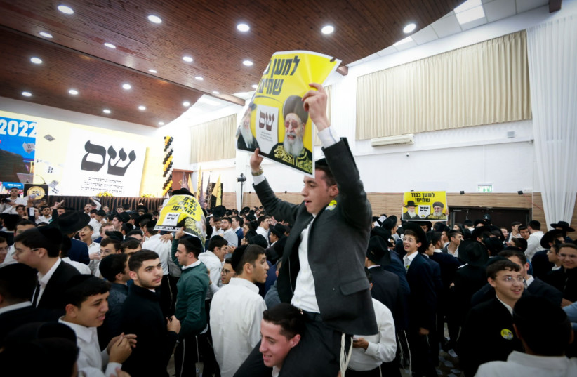  Shas party supporters react as the exit polls of the Israeli elections are announced, in Jerusalem. November 1, 2022. (photo credit: YOSSI ZAMIR/FLASH90)
