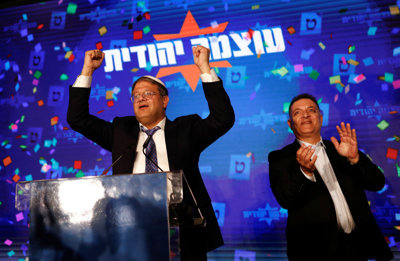  Itamar Ben-Gvir gestures following the announcement of exit polls in Israel's general election, at his party headquarters in Jerusalem November 1, 2022.  (credit: REUTERS/CORINNA KERN)