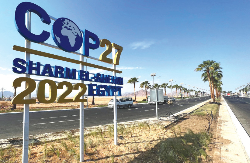   VIEW of a COP27 sign on the road leading to the conference area in Egypt’s Red Sea resort of Sharm el-Sheikh. (photo credit: Sayed Sheasha/Reuters)