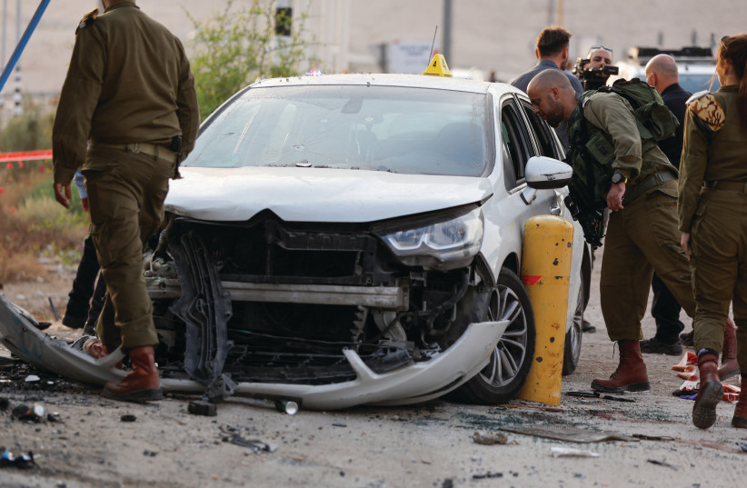  THE SCENE of a Palestinian car-ramming incident against Israelis near Jericho, this week. The writer argues that when Palestinian resisters or combatants attack Israeli soldiers or armed settlers, they are not terrorists. (photo credit: AMMAR AWAD/REUTERS)