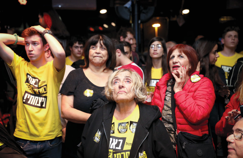  BERKOVITCH SUPPORTERS react as preliminary results of the city’s mayoral race are announced, Nov. 2018. (credit: NOAM REVKIN FENTON/FLASH90)
