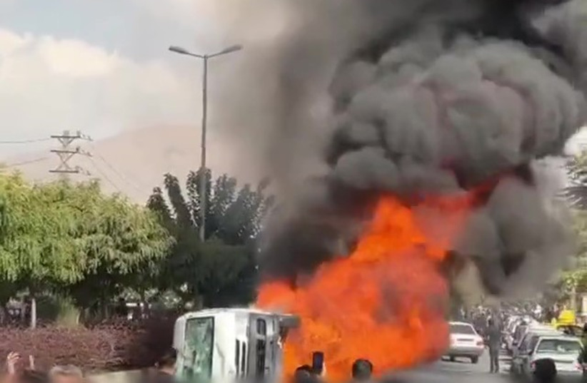  Police vehicle tipped over and torched in Karaj, November 3, 2022 (credit: 1500tasvir)