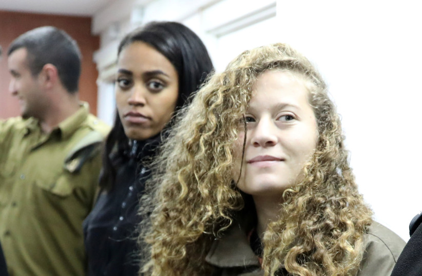  AHED TAMIMI enters an Israeli military courtroom at Ofer Prison, near Ramallah, in 2018.  (photo credit: AMMAR AWAD/REUTERS)