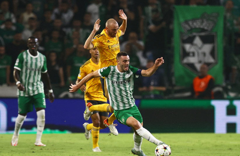  DESPITE THE 6-1 defeat to Benfica in their final match of the group stage, Neta Lavi (front) and Maccabi Haifa had a respectable Champions League showing overall. (photo credit: RONEN ZVULUN/REUTERS)