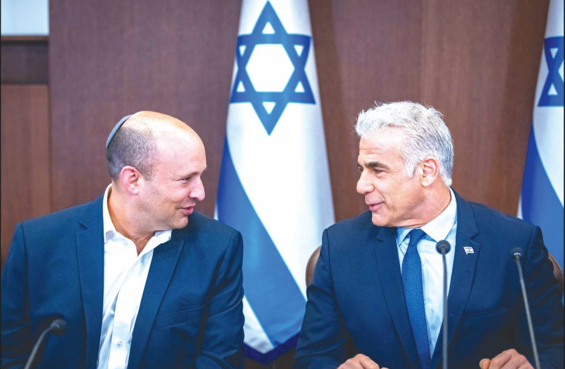 PRIME MINISTER Yair Lapid with Alternate Prime Minister Naftali Bennett at a cabinet meeting in September. (photo credit: OLIVIER FITOUSSI/FLASH90)