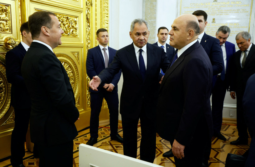  Russia's Prime Minister Mikhail Mishustin, Defence Minister Sergei Shoigu and Deputy Chairman of the Security Council Dmitry Medvedev attend a ceremony to declare the annexation of the Russian-controlled territories of four Ukraine's Donetsk, Luhansk, Kherson and Zaporizhzhia regions, Sep. 30, 2022 (credit: SPUTNIK/DMITRY AZAROV/POOL VIA REUTERS)
