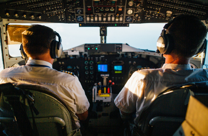  Pilots in the cockpit of an airplane (illustrative) (photo credit: PEXELS)