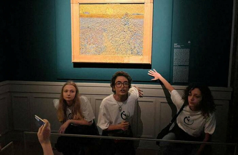  Activists of ''Ultima Generazione (Last Generation)" glue their hands to the wall after throwing soup at a van Gogh's painting "The Sower" at Palazzo Bonaparte in Rome (photo credit: REUTERS)