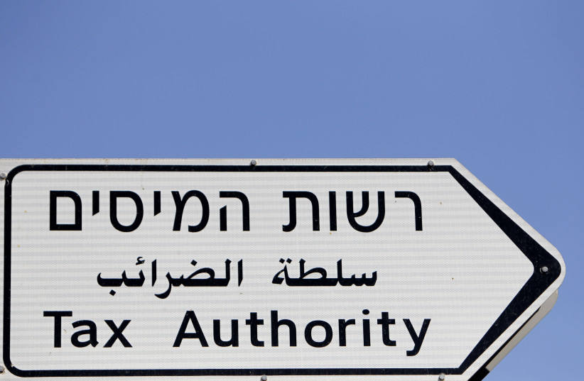  Illustration of a sign leading to the Tax Authorities offices in Jerusalem.  (credit: FLASH90)