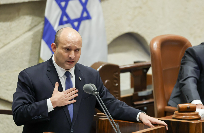  Former prime minister Naftali Bennett adresses the Israeli parliament during a "40 signatures debate" in the plenum hall of the Israeli parliament, on June 13, 2022. Photo by Yonatan Sindel/FLASH90 (photo credit: YONATAN SINDEL/FLASH 90)