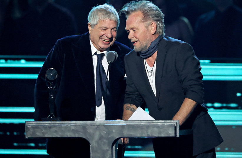  Attorney Allen Grubman, left, and rocker John Mellencamp speak onstage during the 37th Annual Rock & Roll Hall of Fame Induction Ceremony in Los Angeles, Nov. 5, 2022.  (photo credit: AMY SUSSMAN/WireImage via JTA)