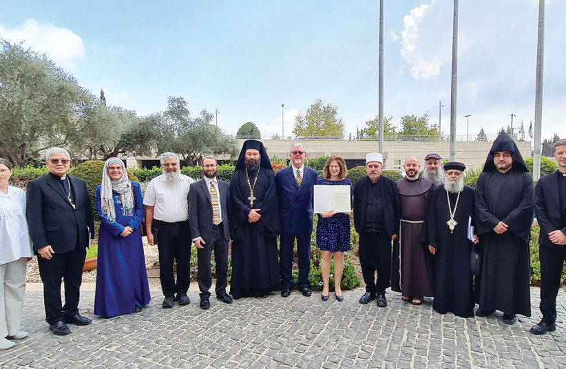  Religious leaders in Israel, including Vatican Ambassador to Israel and Cyprus Archbishop Adolfo Tito Yllana and Rabbi Yonatan Neril, founder and director of the Interfaith Center for Sustainable Development, affirm the Jerusalem Climate Declaration on November 3. (credit: TAL MAROM)