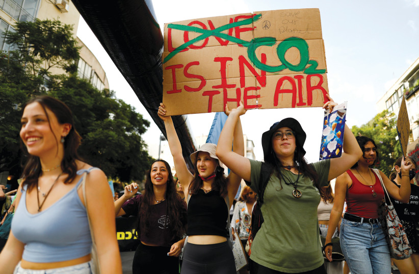  People protest against global warming in Tel Aviv on October 29, 2021.  (photo credit: CORINNA KERN/REUTERS)
