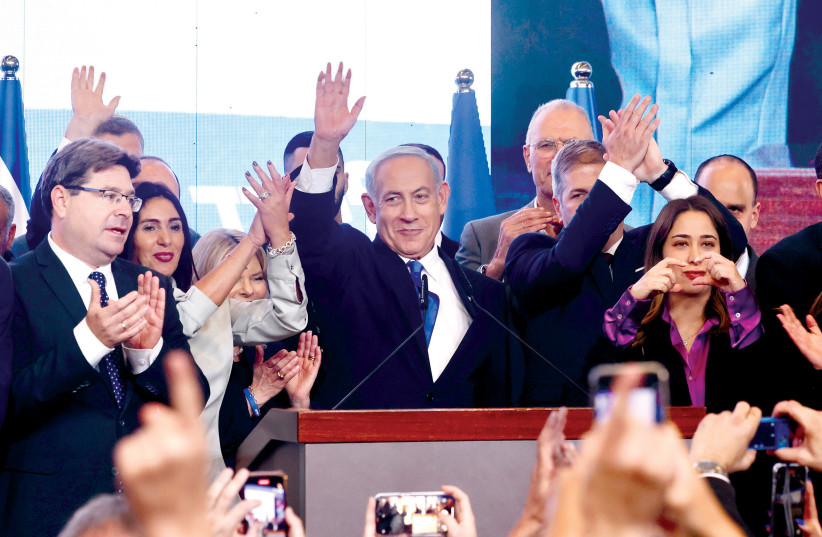  Benjamin Netanyahu and Likud leaders celebrate at party headquarters in Jerusalem on the night of November 1. (photo credit: MARC ISRAEL SELLEM)
