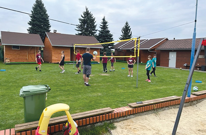  Campers playing volleyball at the sports camp in Palowice this summer. (credit: PASTOR NUCCIARONE)