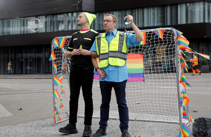 Participants pose as LGBT+ associations protest in front of FIFA World Football Museum, as Qatar is set to host the 2022 World Cup, in Zurich, Switzerland November 8, 2022 (credit:  REUTERS/ARND WIEGMANN)