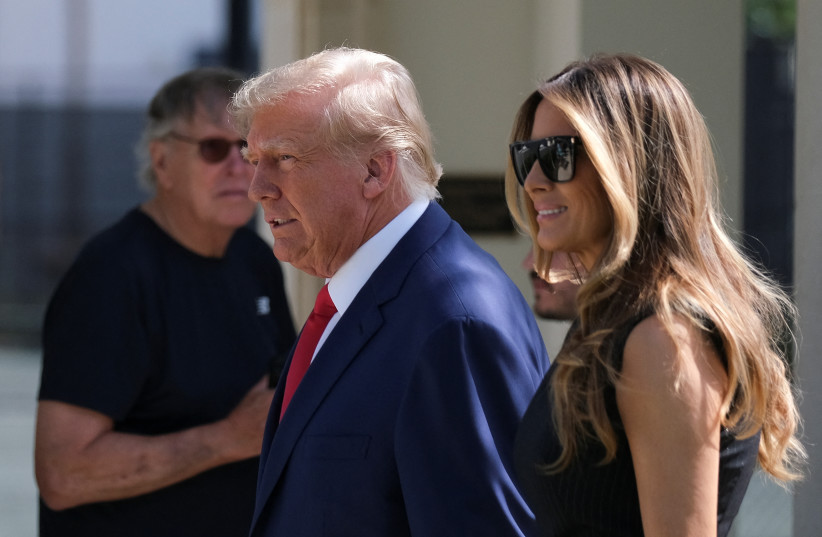  Former US President Donald Trump and his wife Melania walk outside a polling station during midterm election in Palm Beach, Florida, US November 8, 2022 (credit: REUTERS/RICARDO ARDUENGO)
