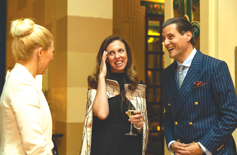 NEW ZEALAND Ambassador Zoe Coulson-Sinclair (center) and Tamir Kobrin (right), general manager of the King David Hotel, chat with a guest at the ‘vin d’honneur’ for new ambassadors.  (credit: MOOLI GOLDBERG)