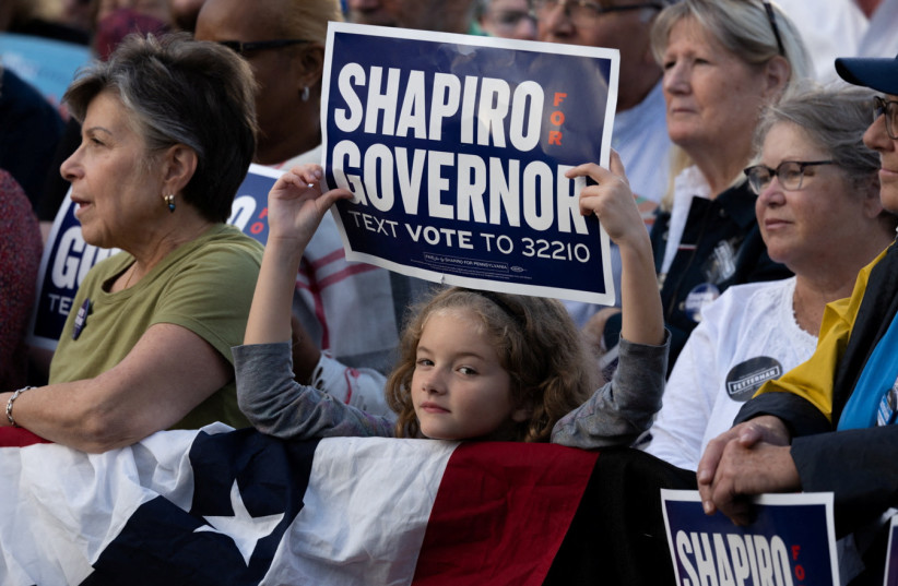  An attendee shows her support at a rally for Democratic candidate for U.S. Senate Lt. Governor John Fetterman and Democratic candidate for Governor Pennsylvania Attorney General Josh Shapiro in Newtown, Pennsylvania, US, November 6, 2022.  (photo credit: REUTERS/HANNAH BEIER)