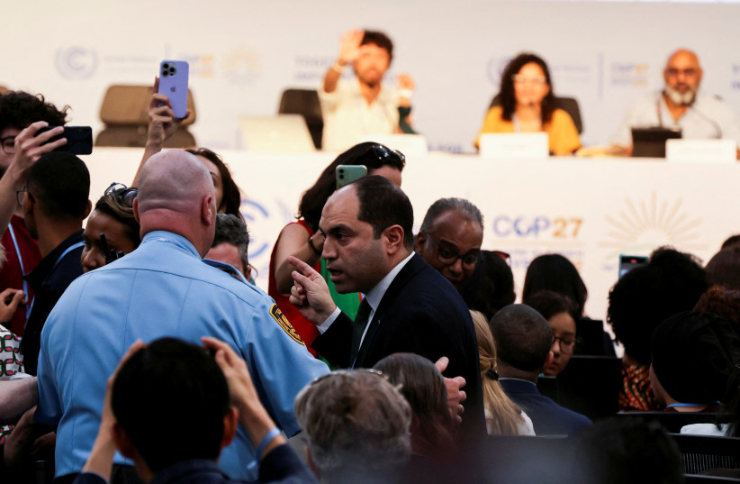  Amr Darwish, an Egyptian MP is escorted out after he criticised the sister of Egyptian-British hunger striker Alaa Abd el-Fattah during a news conference at the COP27 climate summit in Red Sea resort at Sharm el-Sheikh, Egypt, November 8, 2022. (credit: MOHAMED ABD EL GHANY/REUTERS)